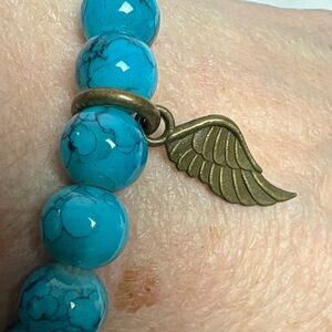 Turquoise glass beaded Bracelet with bronze Wing Charm